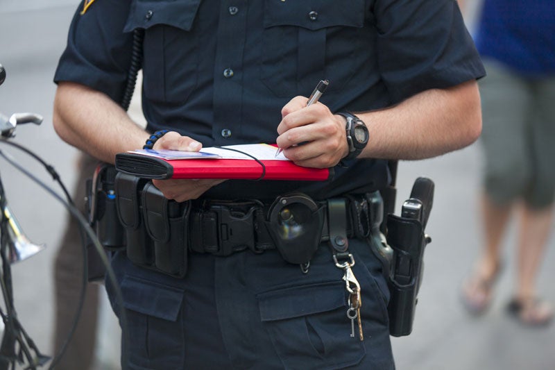officer writing ticket