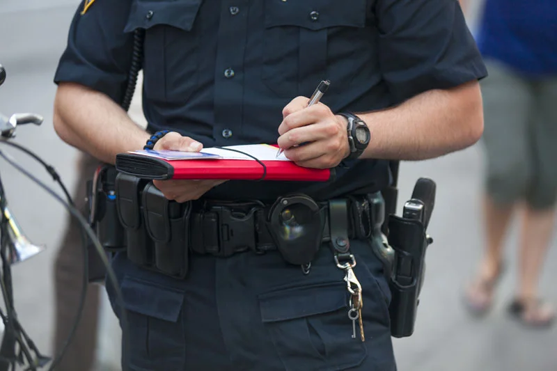officer writing a ticket